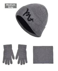 Three-piece winter set in medium grey featuring ribbed knit beanie, gloves, and scarf