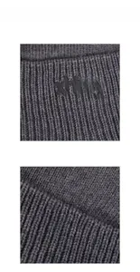 Nahaufnahme der grauen Rippstrick-Textur und des schwarzen xhboy-Logos auf der Mütze