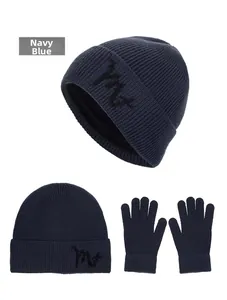 Macro view of navy blue ribbed knit winter hat set featuring embroidered letter detail