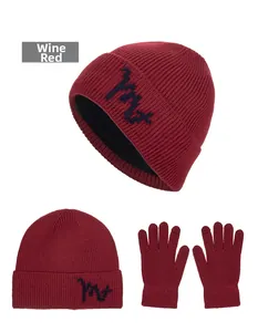 Detail view of wine red winter knit beanie and gloves set with thick warm lining