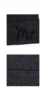 Close-up of ribbed knit texture and black flocking logo on warm winter beanie hat