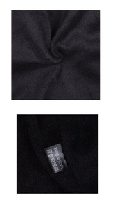 Detailed close-up of warm black fleece lining and quality wash care label on winter beanie