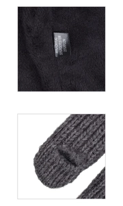 Close-up of grey cable knit texture and black fleece lining with material composition label
