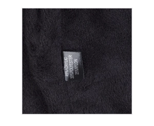 Detailed fabric composition label showing 45% acrylic and 30% polyester blend on winter hat