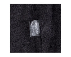 Close-up of the black thermal fleece lining and wash care label showing Made in China