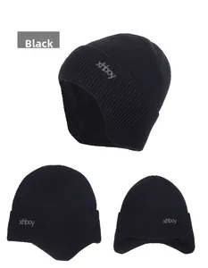 Detailed views of a black winter knit hat with ear flaps and xhboy logo embroidery