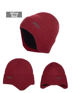 Detail of wine red knit hat with black fleece lining and embroidered xhboy logo