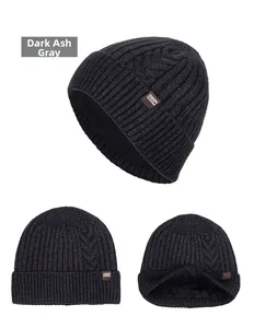 Detail of dark grey knit beanie with thick fleece lining and cable knit texture