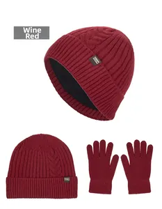 Detail view of wine red winter knit beanie with fleece lining and matching gloves