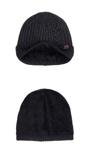 Detail view of winter knitted beanie showing ribbed texture and warm fleece lining