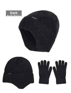 Close-up of thick knitted dark grey marl beanie hat with warm fleece lining and matching gloves