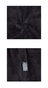 Close-up of knit fabric texture and care label showing 45% Acrylic material blend