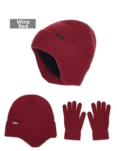 Detail view of wine red knitted winter hat and gloves set with thick fleece lining