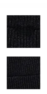 Detailed close-up showing thick black knit texture and XFBOY embossed leather label