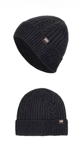 Detailed close-up showing thick cable knit texture and brown XHBOY label on grey winter hat