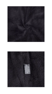 Detailed macro view showing the 45% acrylic material label and soft knitted black fabric