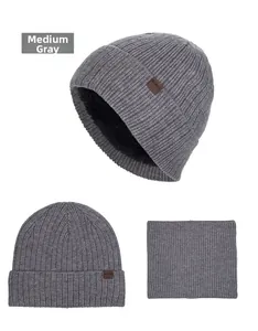 Close-up of the medium heather grey knitted beanie with thick warm fleece lining and leather tag