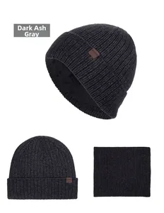 Detail view of dark grey knitted hat and neck gaiter set with fleece lining and XHBOY label