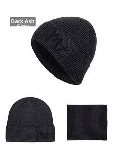 Close-up of winter knit beanie and scarf set in charcoal grey with soft fleece lining