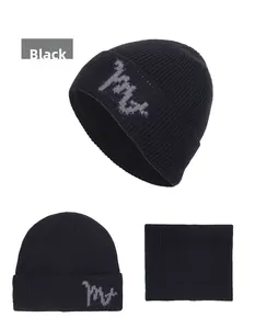 Detail of black winter knit beanie and neck warmer set with fleece lining and M letter