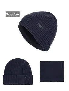 Close-up of navy blue winter knit beanie and scarf set with fleece lining and ribbed texture
