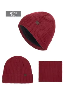 Detail view of burgundy knit beanie set with thick black faux fur lining and neck warmer