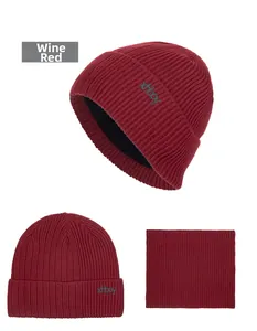 Close-up of wine red winter knit hat and neck warmer with thick black fleece lining detail