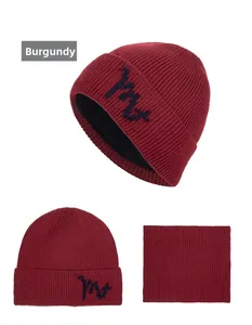 Detail view of burgundy knitted beanie and neck warmer set with thick fleece lining