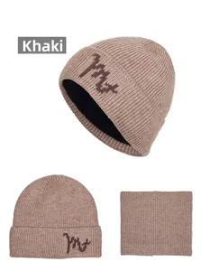 Detailed view of khaki winter knit hat and neck warmer set with fleece lining and soft texture