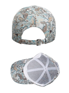 Detail of blue totem baseball cap with golden embroidery and adjustable metal strap back