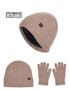 Detail of khaki cable knit winter hat and gloves set with thick black fleece lining