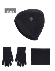 Detailed view of black knitted winter set with fleece lining including hat, gloves and scarf