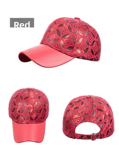 Detail of red floral baseball cap with faux leather brim and adjustable metal buckle