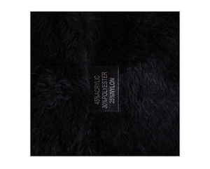Close-up of the plush inner lining and fabric material tag of the winter knit hat
