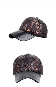 Detail view of baseball cap featuring bronze geometric floral patterns and leather brim