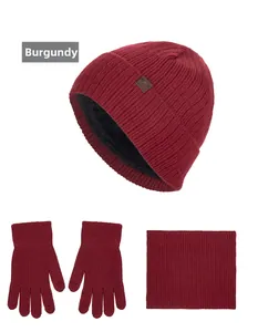 Three-piece wine red winter knit set with fleece-lined earflap hat, gloves and neck warmer