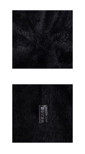 Detailed view of the soft black fleece lining and care label on this winter knit beanie