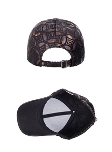 Detail of adjustable silver metal buckle and bronze geometric pattern on baseball cap