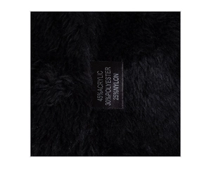 Detail showing soft black fleece lining with 45% Acrylic material composition label