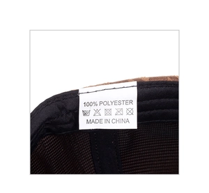 Detail shot of internal wash label for houndstooth baseball cap showing material and care