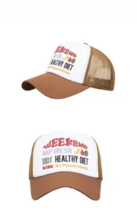 Detail of WEEKEND embroidery and brown mesh on contrast color trucker baseball cap