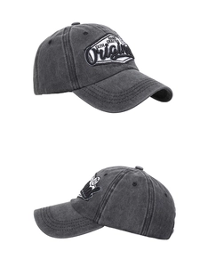 Detail of vintage black washed cotton baseball cap with Original hand crafted embroidery