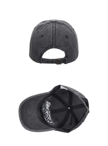 Detail of grey washed cotton baseball cap with metal buckle and interior brim embroidery