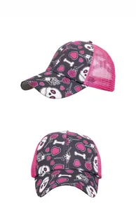 Detailed view of the mesh trucker hat with pink heart, rose, and skull print design
