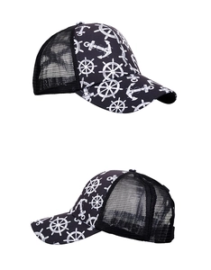 Detail view of trucker hats showing nautical anchor prints and breathable black mesh