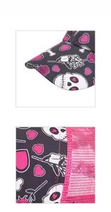 Detailed close-up of breathable pink mesh and floral skull embroidery on the baseball cap
