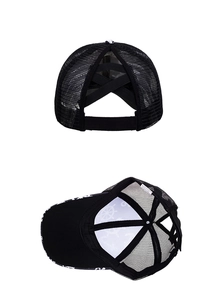 Detail view of black mesh ponytail baseball cap with cross elastic bands and anchor lining