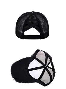 Detail view of the criss-cross elastic bands and mesh structure of a ponytail trucker hat