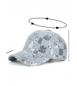 Detail of light blue denim baseball cap with silver sequins and 100% polyester material