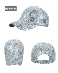 Detail view of light blue denim baseball cap with silver sequin checkerboard pattern